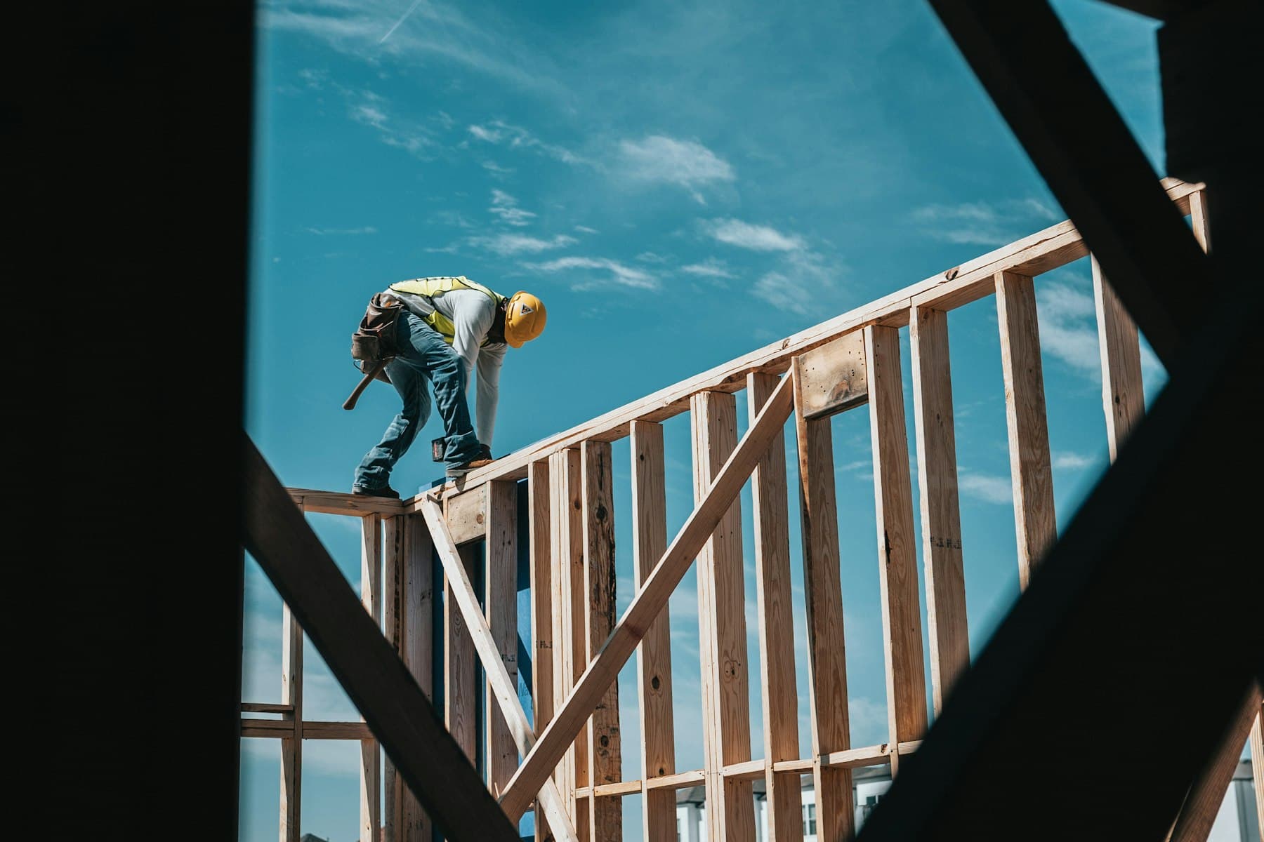 Framing carpenter working on the wall frame of a new home